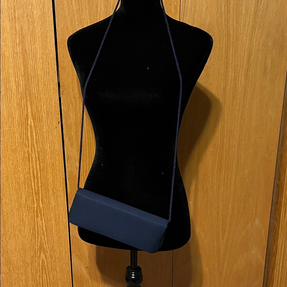 La Regale dark blue iridescent satin clutch. Rope strap.